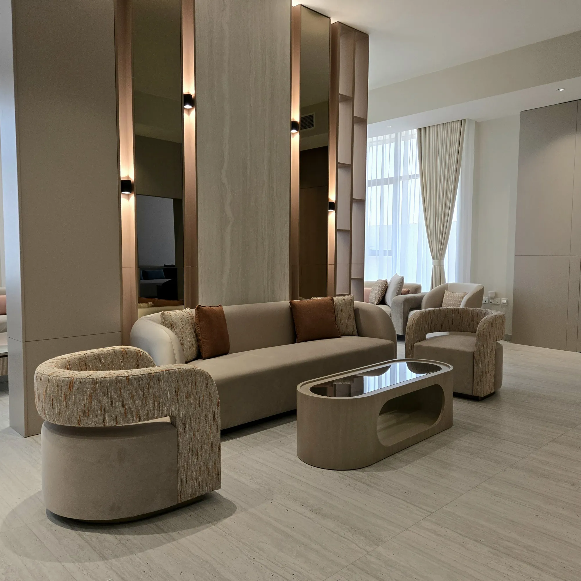 A completed Trend interior: travertine, bronze detailing and bespoke joinery